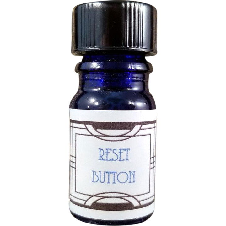 Reset Button by Nui Cobalt Designs perfume bottle