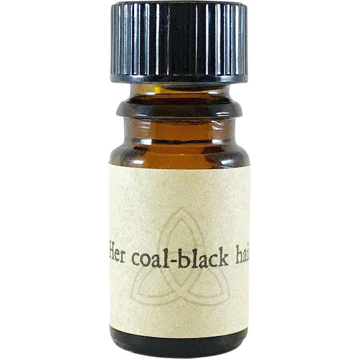 Her coal-black hair by Arcana Wildcraft perfume bottle